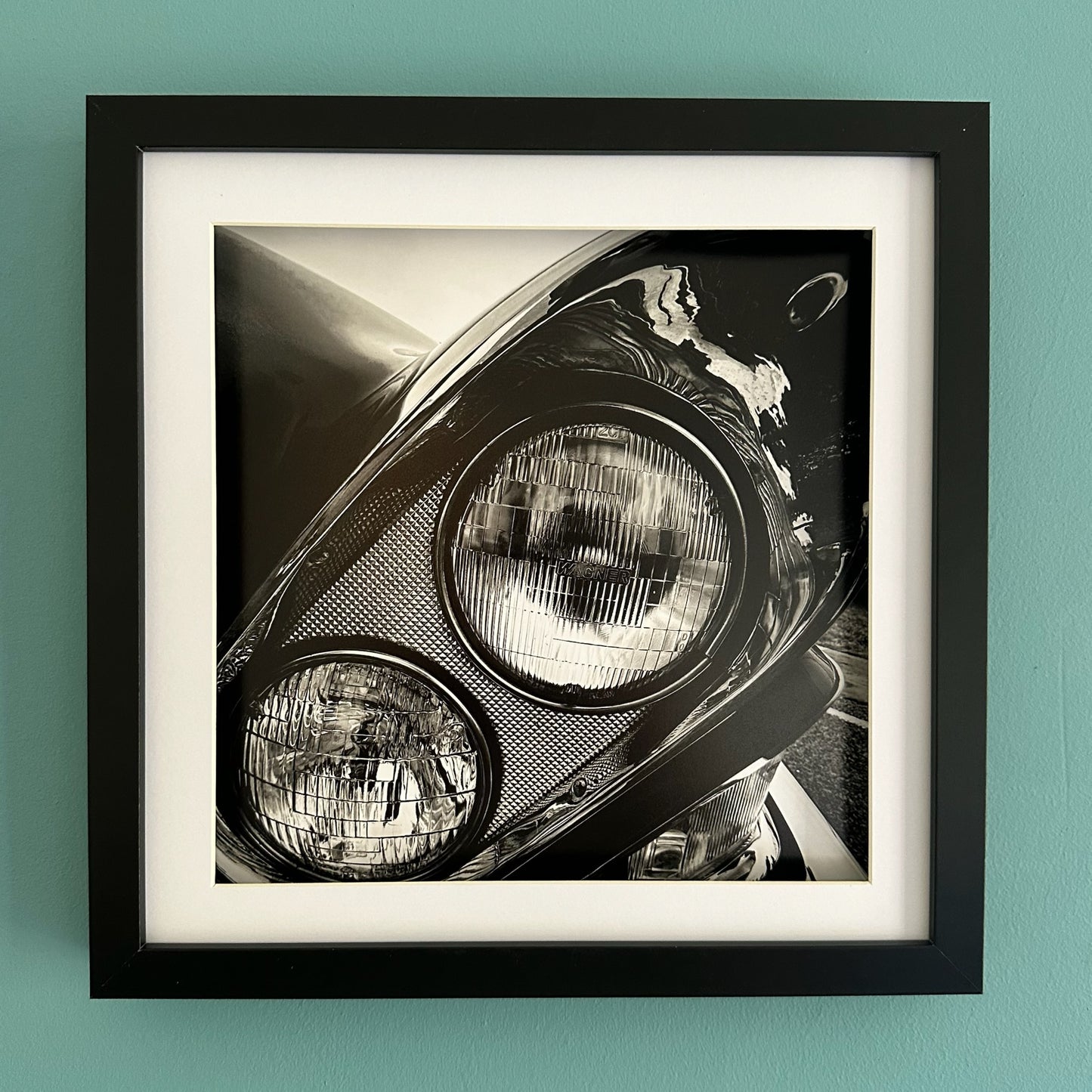 Monochrome Classic Car Headlight - Black Framed Print